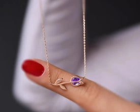 Elegant floral-inspired amethyst pendant in sterling silver.