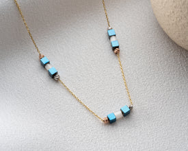 Model wearing hematite necklace styled for yoga