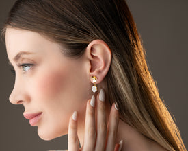 Wedding aisle detail shot with veil and floral earrings