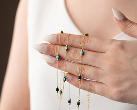 Jewelry set laid on black velvet with ambient lighting