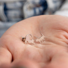 Minimalist and elegant silver earrings with cat silhouette design.