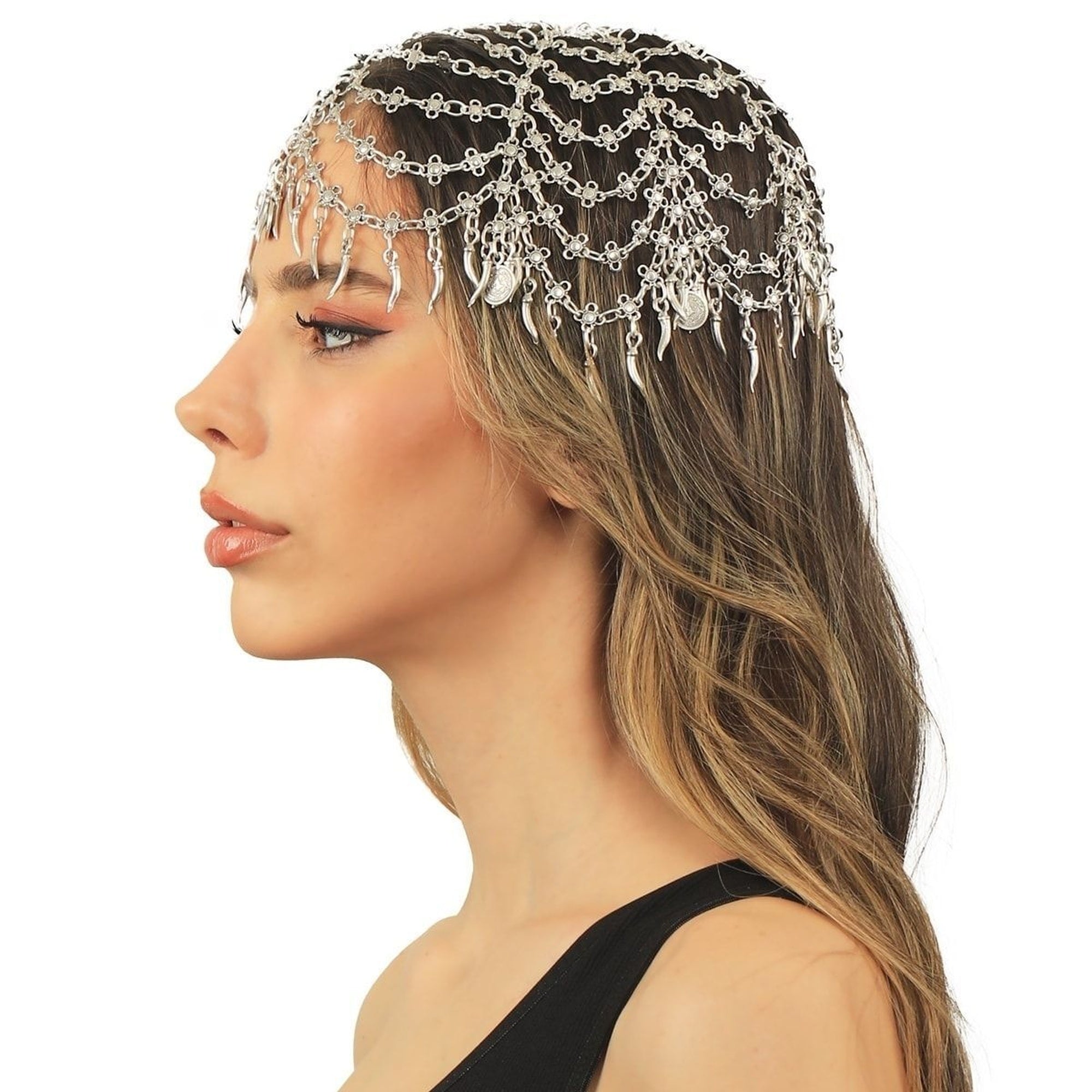 Woman wearing a decorative chain headpiece on a white background