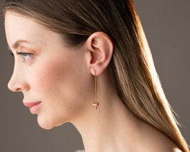 Artistic nature earrings with fluttering hummingbird design