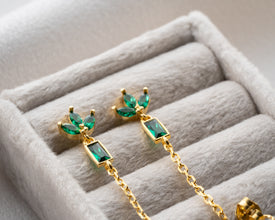 Day-to-night styling: dainty floral earrings with blazer and evening clutch