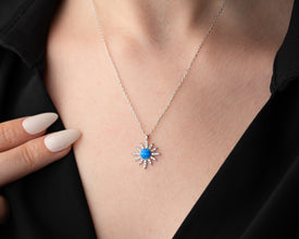  A model wearing a sterling silver moon and star necklace, capturing celestial elegance.