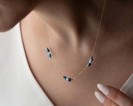 Hematite necklace paired with white blouse for workwear look