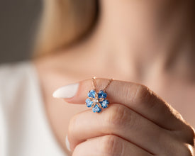 Dainty floral necklace with topaz gemstone center