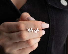 Close-up of nature-inspired silver bird earrings, crafted in 925 sterling silver.