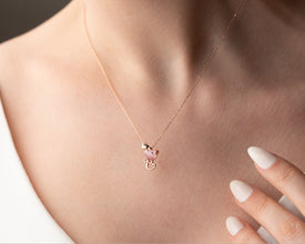 Woman wearing Pink Whiskers Heart Necklace for daily wear