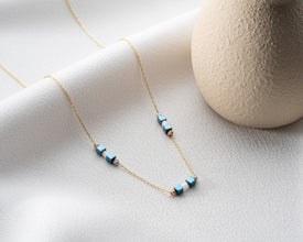 Crystal necklace styled with yoga wear