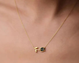 Nature-inspired floral necklace with a shimmering mystic gemstone accent.