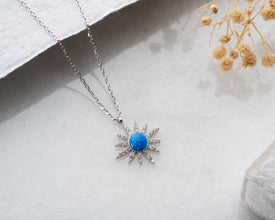 A sterling silver celestial necklace featuring a delicate moon & star pendant, perfect for astrology lovers.