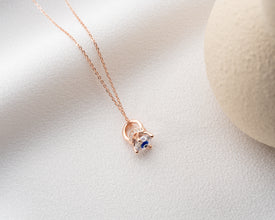 Elegant celestial jewelry piece showcasing an Evil Eye pendant, perfect for astrology lovers.