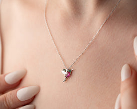  A sterling silver hummingbird charm necklace, symbolizing freedom, happiness, and resilience.