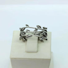 Studio photo of a silver leaf vine adjustable ring on a white background, showcasing the elegant botanical design for womenÕs jewelry.