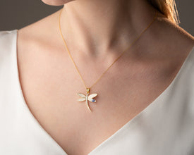 Boho-style necklace with dragonfly and protective charm