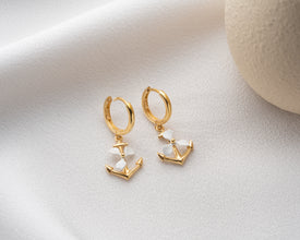 Polished silver detailing on propeller and anchor charms