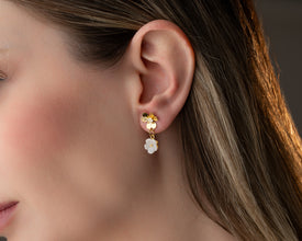 Artisan crafting gold floral motifs in workshop