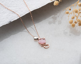 Sterling silver cat necklace in bright natural light