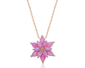 Handcrafted sterling silver lotus pendant necklace with an ethereal pink opal gemstone centerpiece.