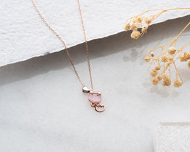 Cat necklace styled with other silver minimalist pieces