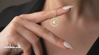 Close-up of a radiant sun pendant necklace, crafted in gold-plated sterling silver for an elegant look.
