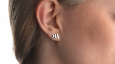 Elegant bird earrings in sterling silver, a timeless gift for bird lovers and travelers.