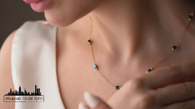 Model wearing hematite cube necklace and earrings jewelry set