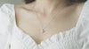 A timeless bird-shaped pendant necklace with a luminous opal gemstone.