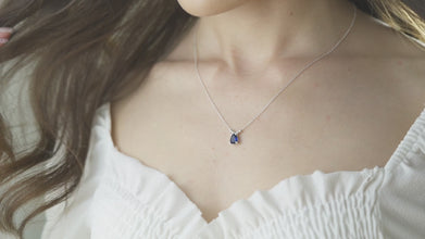 Dainty and delicate sapphire pendant on a fine silver chain.