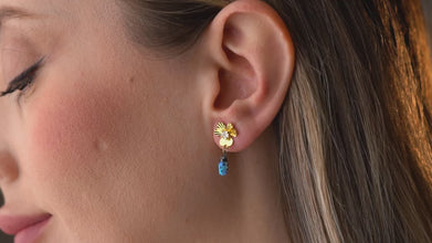 Model wearing Blue Ladybug Earrings with casual outfit