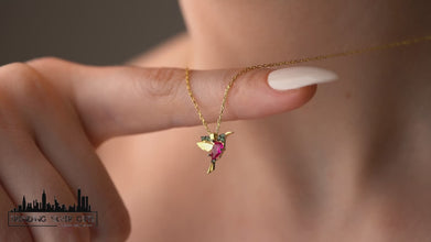 Close-up of an elegant silver hummingbird pendant, crafted for bird lovers and free spirits.