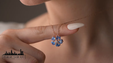 Close-up of handcrafted flower charm in sterling silver