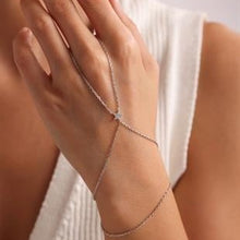 Silver bracelet on a wrist with a blurred background