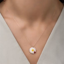 Daisy flower necklace on a mannequin with a light gray background