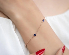 Close-up of a sapphire bracelet, a delicate and stackable gemstone jewelry gift for women.