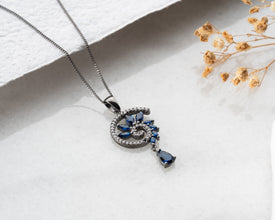 Macro shot of sapphire trapped in spiral cage - gothic jewelry craftsmanship