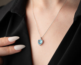 Ocean-inspired aquamarine gemstone pendant symbolizing love & serenity.