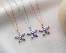 Lightweight and delicate silver flower pendant, ideal for vintage jewelry lovers.