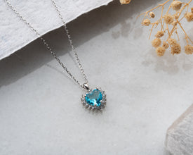  Elegant gemstone heart pendant in silver, designed for layering or solo wear.