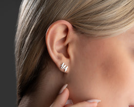 Lightweight silver bird stud earrings, a chic addition to minimalist jewelry collections.