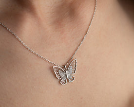 Symbolic butterfly charm necklace representing transformation & beauty