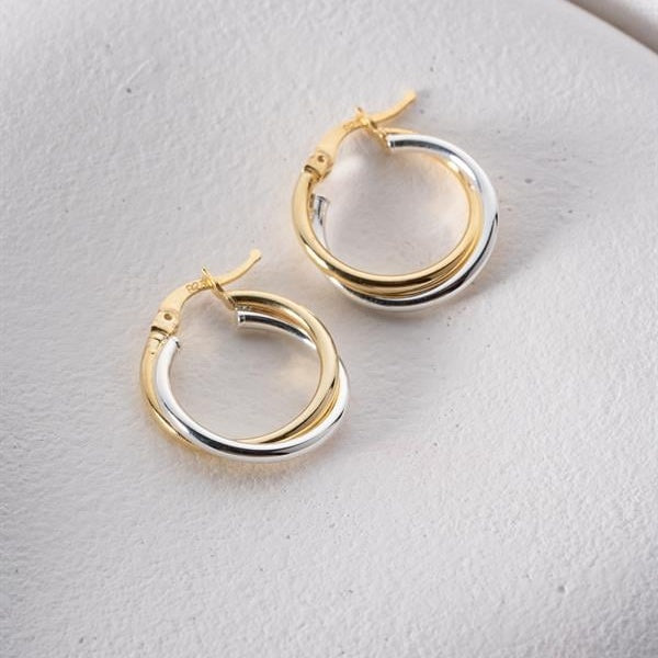 Pair of gold hoop earrings on a light gray background