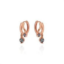Rose gold hoop earrings with small gemstones on a white background