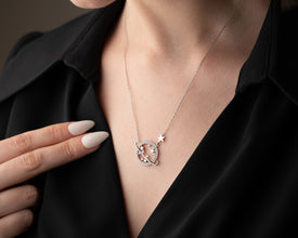 A model wearing the sterling silver Saturn necklace, showcasing its delicate celestial charm and astrology symbolism.