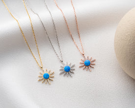 Handmade lunar pendant necklace on a celestial-themed jewelry display.