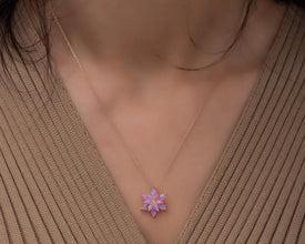 A minimalist sterling silver lotus pendant, perfect for layering or wearing as a statement jewelry piece.