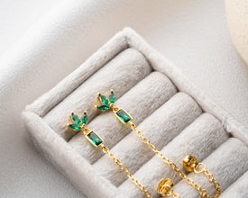 Full moon ceremony detail featuring lotus earrings on velvet cloth