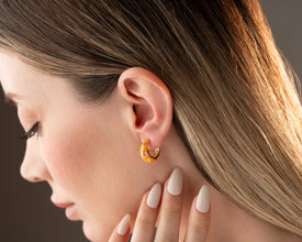 Starry night-inspired hoop earrings with astrology-themed detailing and celestial shimmer.