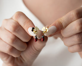 Cute silver ladybug earrings on display, perfect gift idea